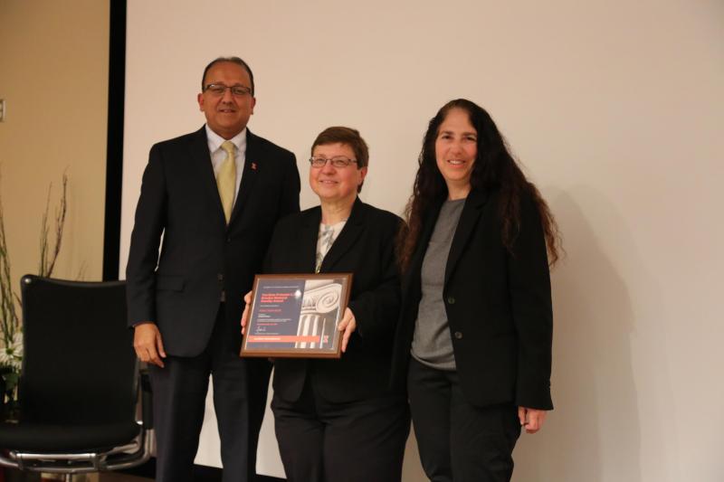 Klara Nahrstedt receiving her award from Engineering Dean Rashid Bashir and CS Department Head Nancy Amato